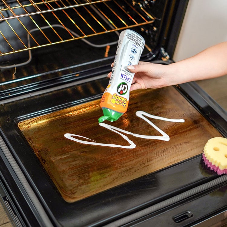 Cif being put on oven door