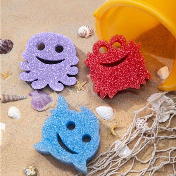 Scrub Daddy Summer Shapes in bucket on beach